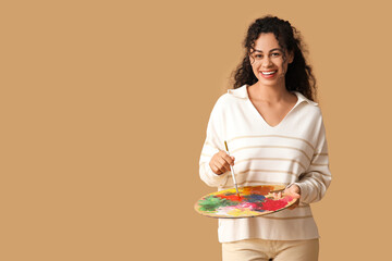 Female African-American artist on beige background