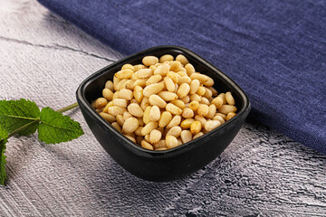 Peeled cedar nut in the bowl
