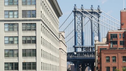 New York City Manhattan Bridge view from Brooklyn Bridge. Red brown brick residential building windows. Classic NYC architecture. United States real estate in Brooklyn.