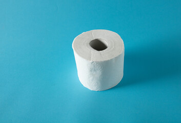 White toilet paper thrown into cold blue water