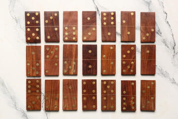 Many wooden dominos blocks on white background
