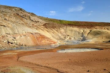 the colorful hot springs in the volcanic solfatara fields of krysuvik geothermal area on a sunny day in the mountains near harfnarfjordur, south of reykjavik, iceland