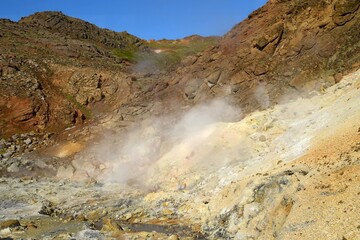 the colorful hot springs in the volcanic solfatara fields of krysuvik geothermal area on a sunny day in the mountains near harfnarfjordur, south of reykjavik, iceland
