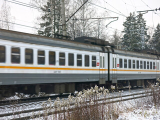 Fototapeta premium Russian suburban train runs in winter