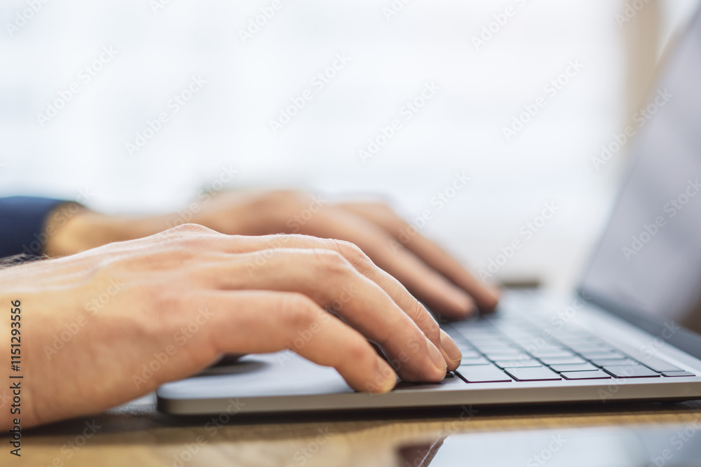 Poster the image shows a close-up of a man's hands typing on a state-of-the-art laptop keyboard, with an of
