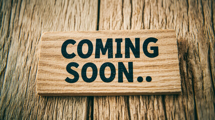 Wooden sign with 'coming soon' message on rustic wooden background