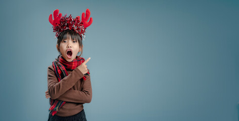 A little girl is happy to join the christmas day.