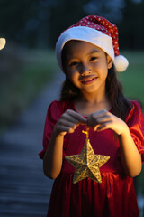 A little girl is happy to join the christmas day.