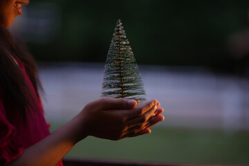 A little girl is happy to join the christmas day.
