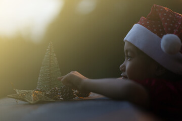 A little girl is happy to join the christmas day.
