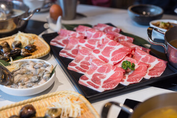 Freshly prepared hotpot ingredients on table