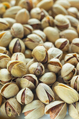 Food Concepts. Extreme Closeup View of Fried Fresh Pile of Pistachios Both Whole and Grinded.