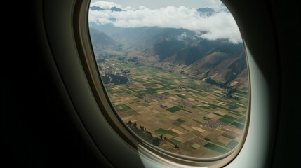 Fototapeta premium Gazing out from the cabin, one can delight in the stunning tapestry of patchwork fields, rugged mountains, and fluffy clouds that decorate the sky. Nature's beauty unfolds below
