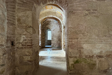 Ruins ancient medieval city old church Lycian rock tombs stone temple in Türkiye, UNESCO World Heritage Site, top arches, keystones, columns, torso statue, corridors, rooms