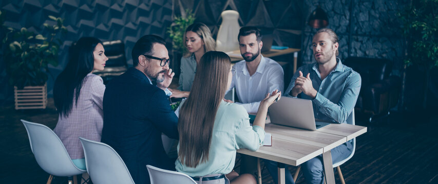 Minded pensive investors sit desk chair gather want decide work start-up crisis reduce solution blonde hair man discuss enterprise goals brown hair female in modern office