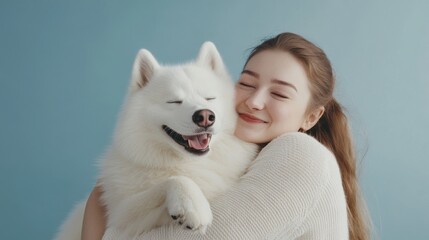 Fototapeta premium intimate pet portrait, woman cuddling fluffy samoyed dog, casual neutral outfit, pure joy emotional capture, minimalist pastel blue setting, professional studio shot, candid moment, high resolution