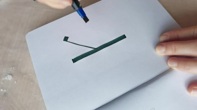 A stepbystep guide to precision calligraphy demonstrating stylistic pen movements on paper.