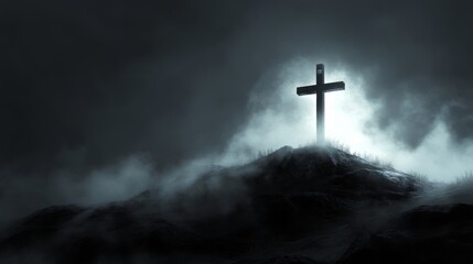 Naklejka premium A solitary cross stands atop a misty hill