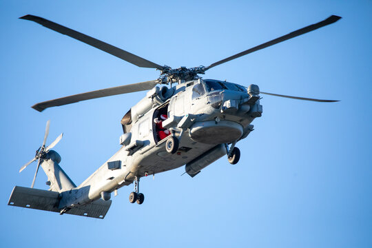 A U.S. Navy Helicopter Flying Overhead