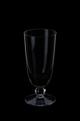 empty champagne flute glass on black background