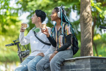 Young Adults Relaxing with Eco Transportation.