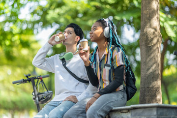 Young Adults Relaxing with Eco Transportation.