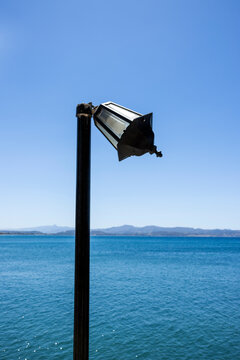 Bent streetlight at the harbor of Agia Galini on the south coast of Crete, Greece