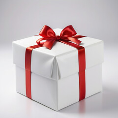Obraz premium a white box with a red ribbon and a bow