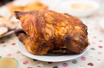 Whole roasted chicken on a plate