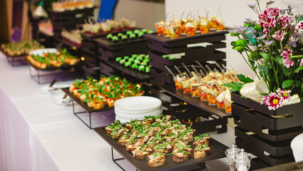 A contemporary hotel dining area featuring a sleek buffet setup.