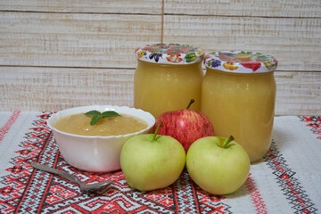 applesauce with jars, Jars of fresh apple sauce with yellow and red apples
