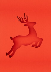 A vertical Christmas reindeer shape cutout in vibrant red paper, perfect for festive design projects. The minimalist style evokes seasonal cheer and holiday spirit