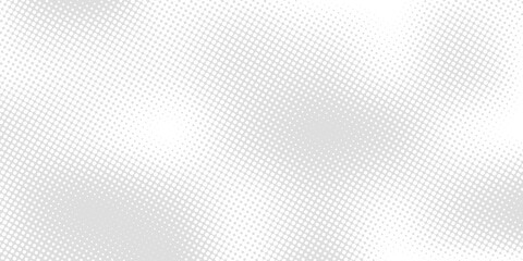 Abstract halftone dots gray on white background. Abstract halftone pattern in shades of gray. A modern, minimalist halftone pattern. A seamless, geometric pattern featuring a halftone effect