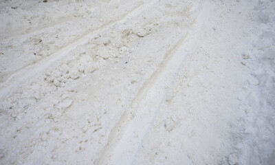 Road covered with snow and mud in winter.
