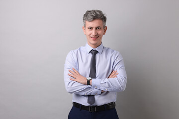 Portrait of businessman on light grey background