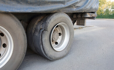 Cargo truck tire blowout on the road.