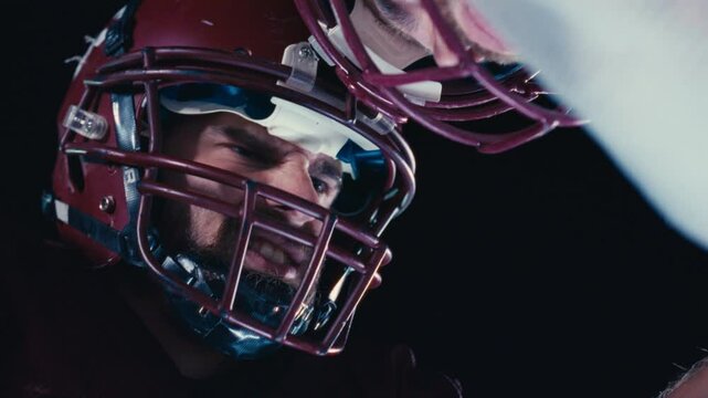 Intense Faceoff Between American Football Players