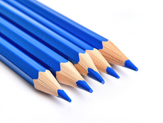 Fototapeta premium Vibrant Blue Pencils Against a White Background: A Close-Up Exploration of Sharp Tips and Clean Lines, Celebrating the Beauty of Everyday Writing Tools.