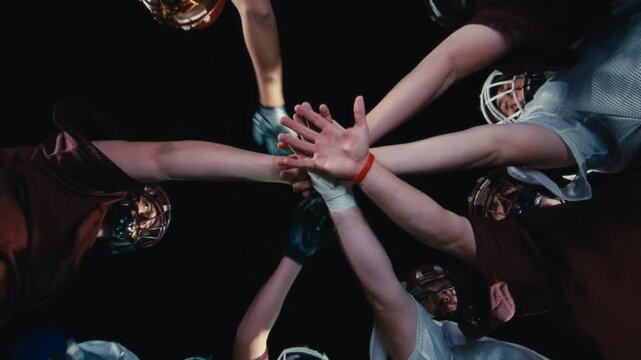 American Football Players Joining Hands in circle Concept of United Team Spirit in Action
