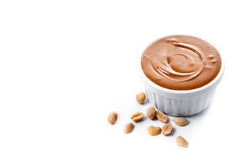 Peanut butter in a bowl isolated on white background. Copy space