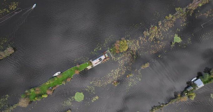 Descending drone footage over Small recreational houses at Scheendijk, Loosdrechtse plassen