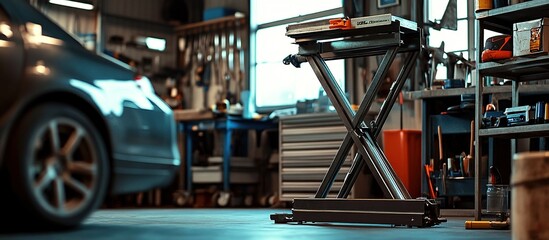 Scissor car lift in auto repair shop.