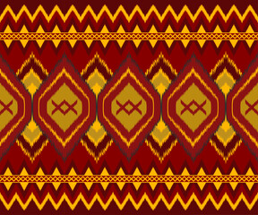 Vibrant geometric pattern featuring diamonds and zigzags in red, yellow, and gold tones, perfect for textiles or backgrounds