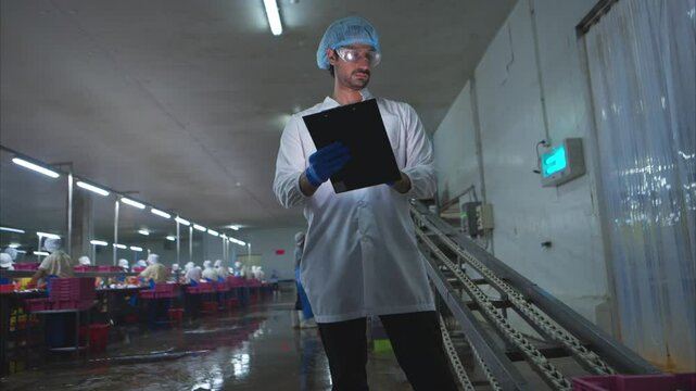 Raw material quality inspectors evaluate and inspect fish pieces before they enter the canned fish production process