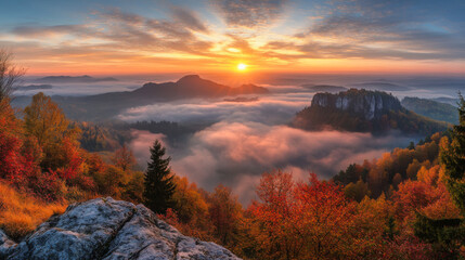 Fototapeta premium Majestic sunset over hazy valley with autumn foliage and distant mountains in peaceful landscape
