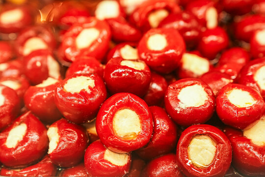 "peppadew peppers stuffed with cheese." These are small, sweet piquant&eacute; peppers, typically red, filled with a soft cheese such as cream cheese or a similar creamy filling.