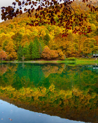 Bethmale lake in Ari&egrave;ge in autumn with colorful foliage.