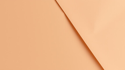 A close-up view of two sheets of peach-beige paper, overlapping in a clean, geometric design