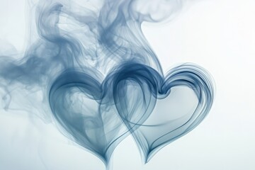 two heart shapes formed from smoke on a white background
