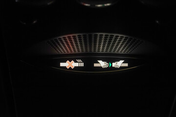 No smoking and please fasten your seat belt - symbol on the aircraft. Seat belt notification signal...